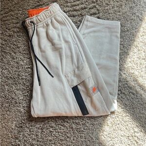 Nike Beige Joggers with Vibrant Orange Waistband